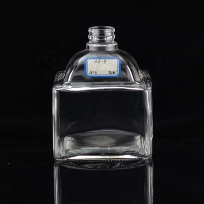 Industrial 700ml Glass Bottle for Beverage Industry in Thumb Shape