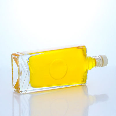 Industrial Liquor square glass bottle with guala cap and customizable capacity