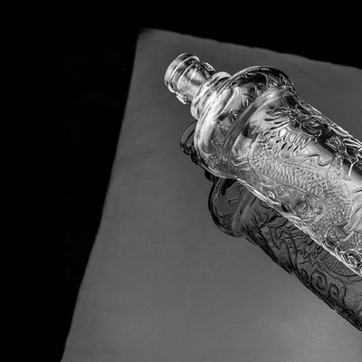 Beautiful Dragon Embossed Glass Bottle With Golden Lid Customized Logo and Glass Base
